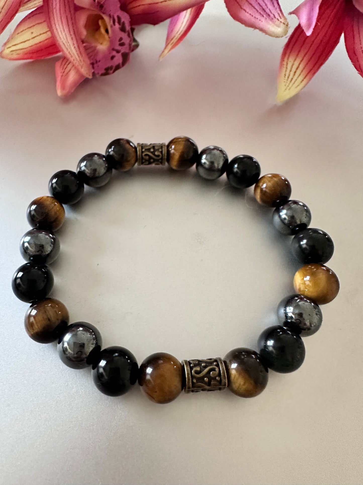 This bracelet has tigers, eye hematite, and black onyx - Creations by Rosa