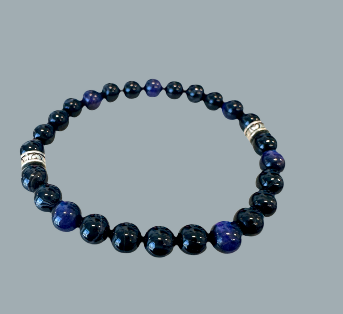 stretch bracelet features raw Black Chalcedony and Tigers Eye beads.