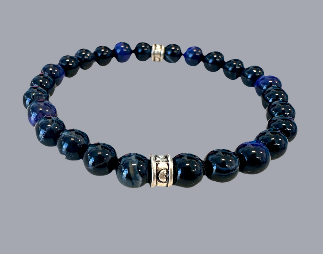 stretch bracelet features raw Black Chalcedony and Tigers Eye beads.