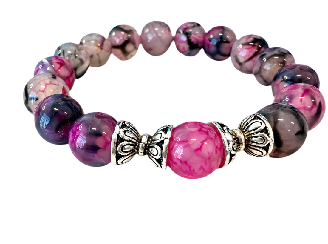 This handmade bracelet sports 10mm natural, high-grade beads, a secure stretchy cord, and a central agate dragon vein stone, complemented by two silver spacers.