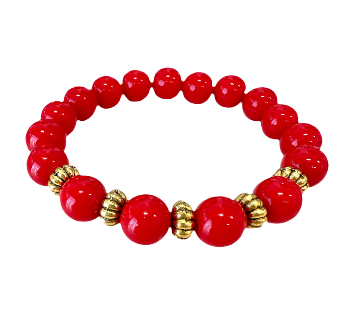 This high-quality Red Coral bracelet, designed with handmade stretches and gold and rondelle spacers, is an ideal present for anyone.