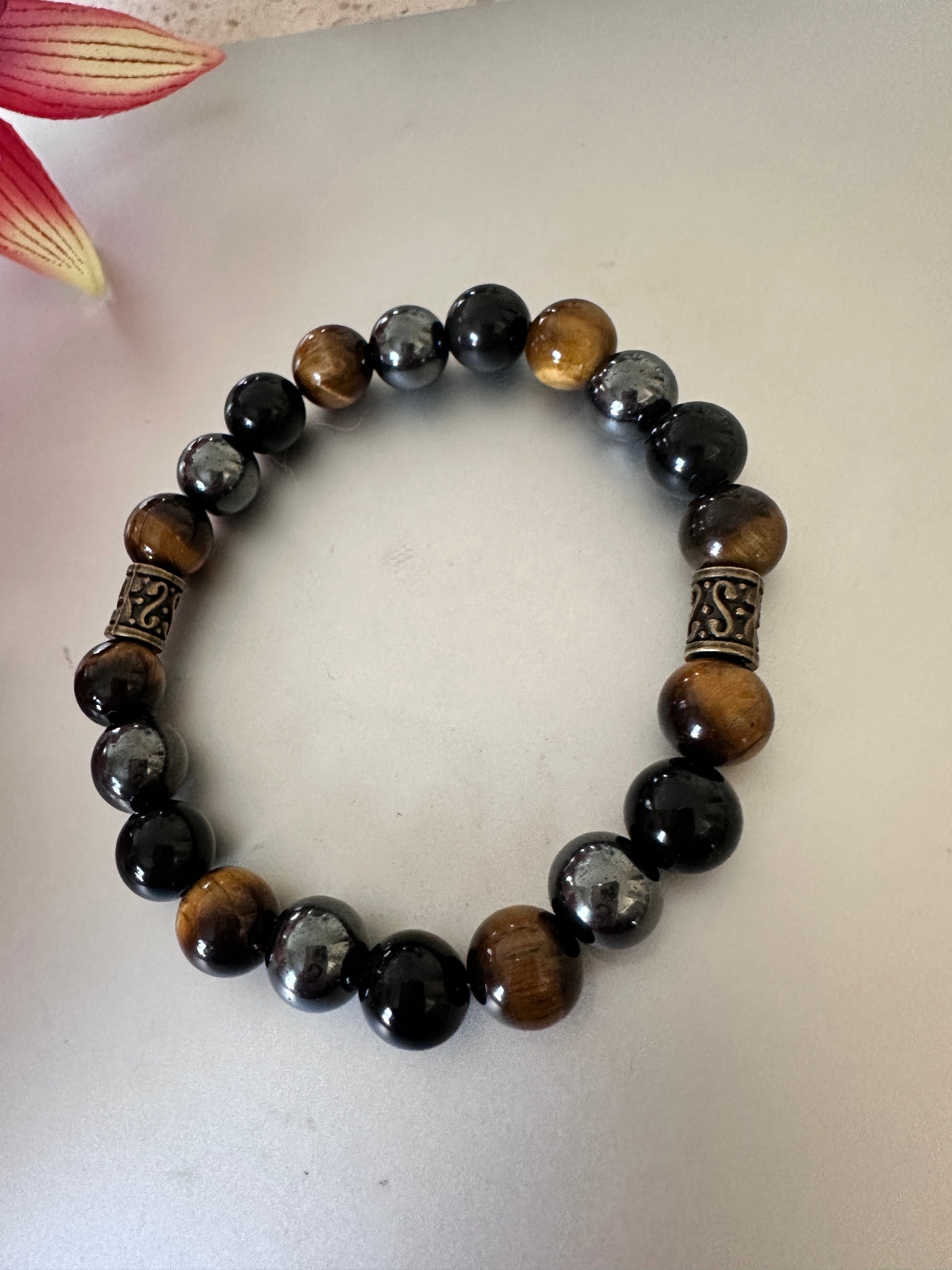 This bracelet has tigers, eye hematite, and black onyx - Creations by Rosa