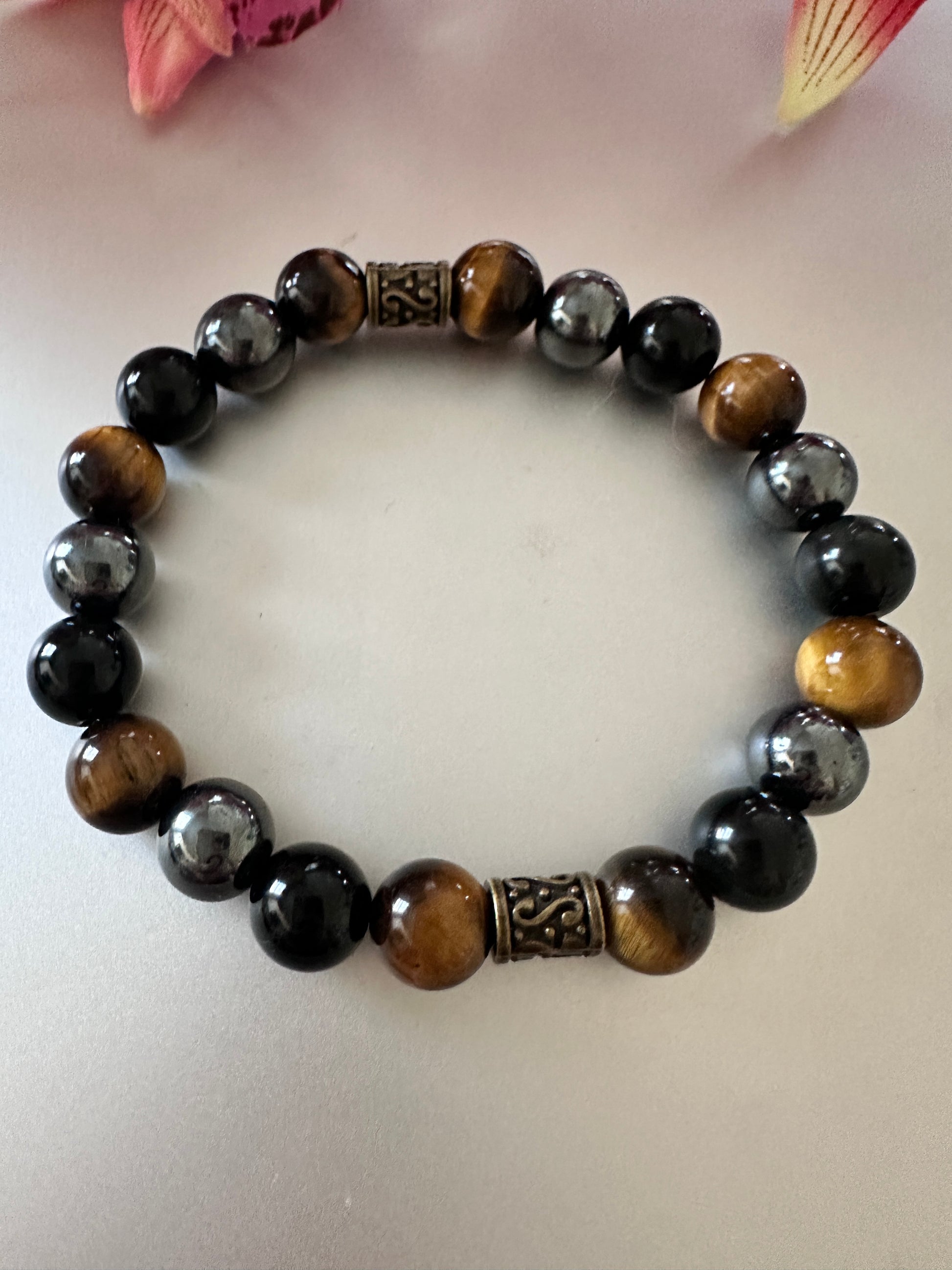 This bracelet has tigers, eye hematite, and black onyx - Creations by Rosa