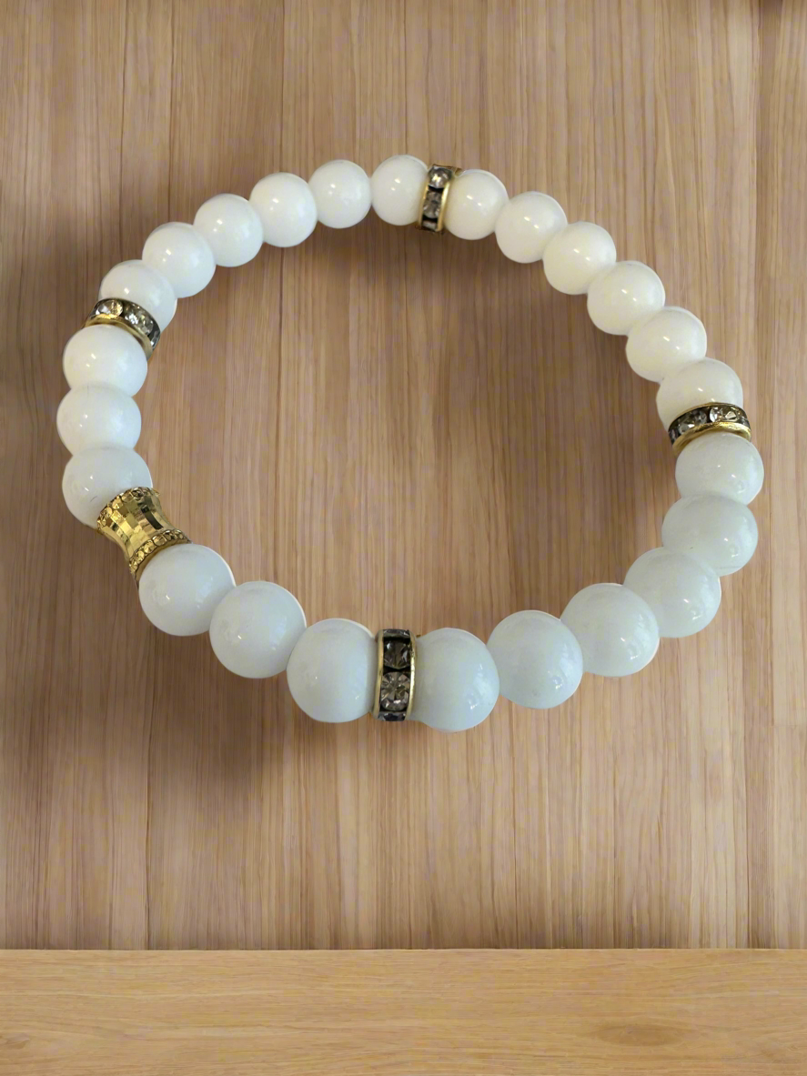 White Agate & Onyx Beads stretch, bracelet, with gold plated spacers.