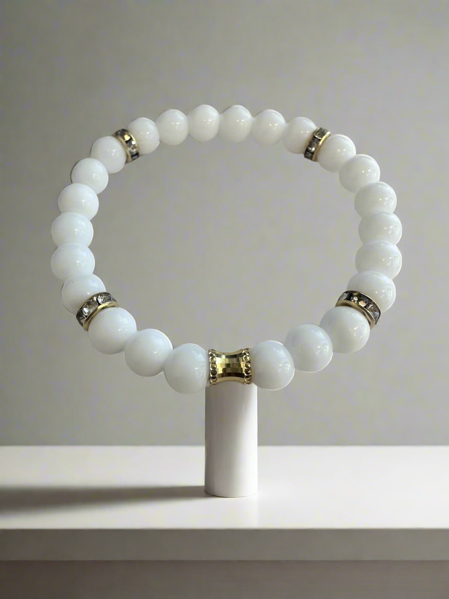 White Agate & Onyx Beads stretch, bracelet, with gold plated spacers.