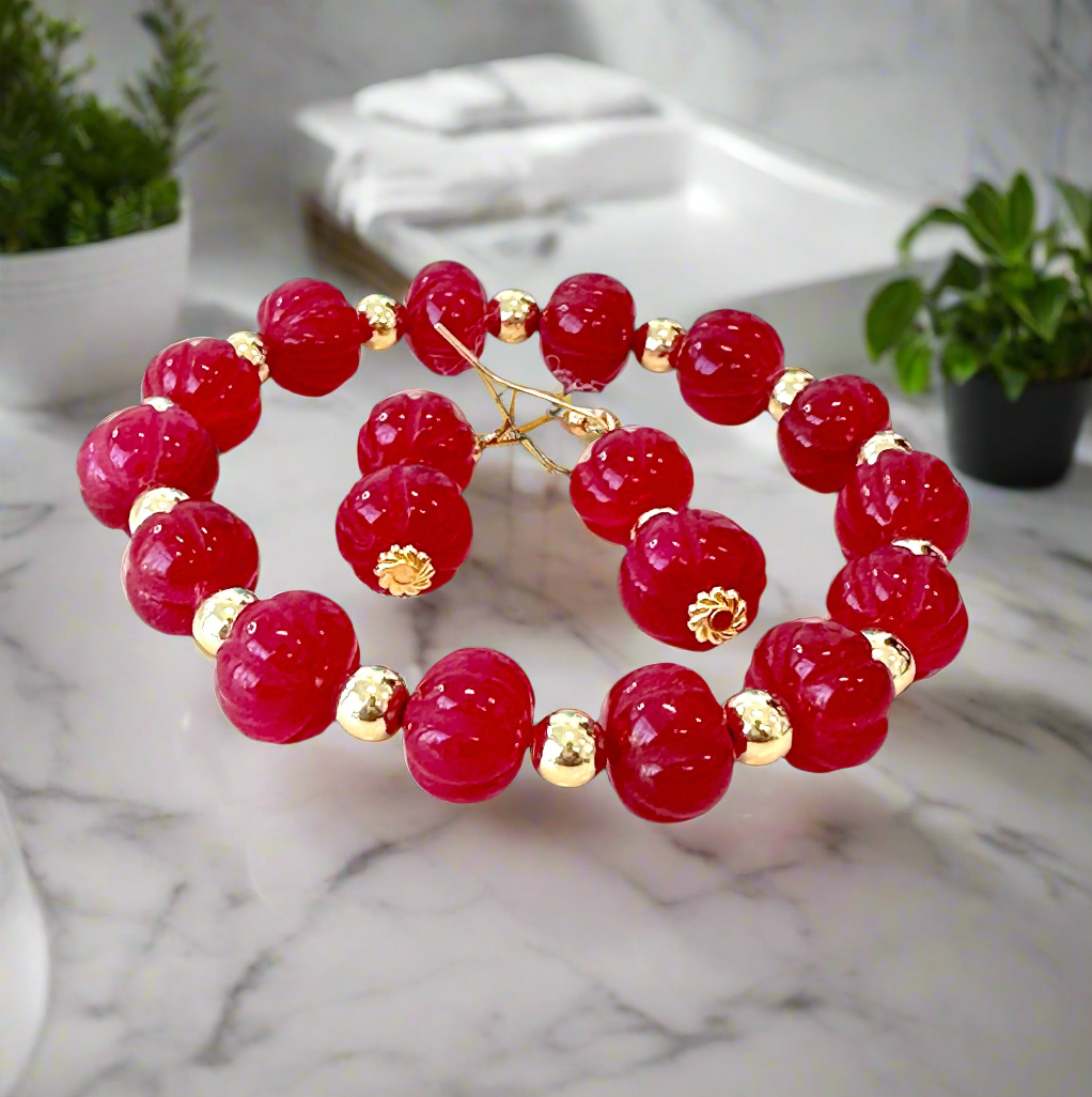 This beautiful Ruby Gemstone Stretch Bead Bracelet and Earrings set is the perfect addition to any jewelry collection. Handmade with care and attention to detail, it features stunning 18 karat Gold Filled 6mm beads and larger 18 karat Gold Filled 10mm bea