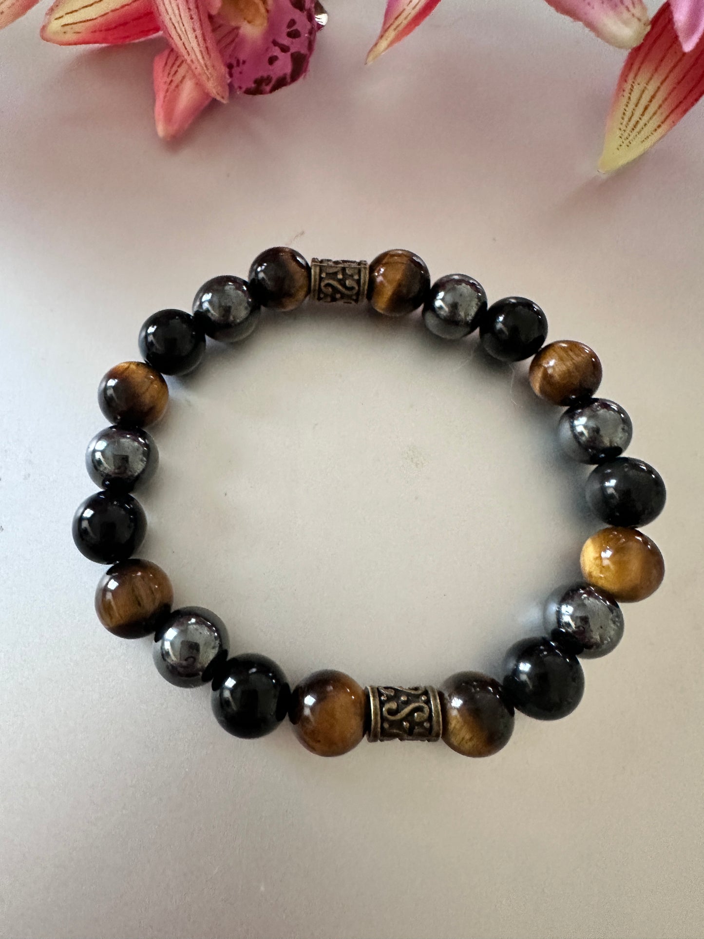 This bracelet has tigers, eye hematite, and black onyx - Creations by Rosa