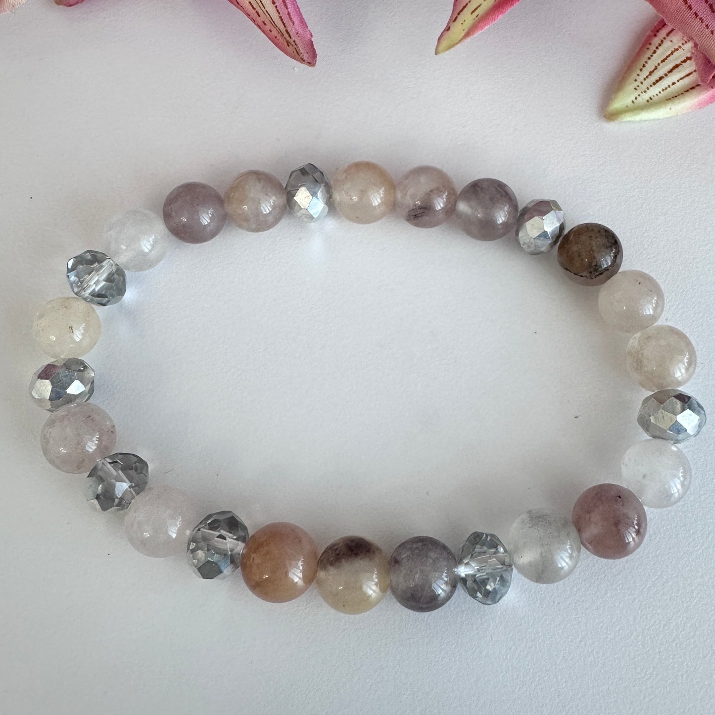 This delicate bracelet is handmade with a sterling silver HOPE pendant, 6 mm white silver rondelle Austrian crystal spacers, and 8 mm Morganite stretch beads. - Creations by Rosa