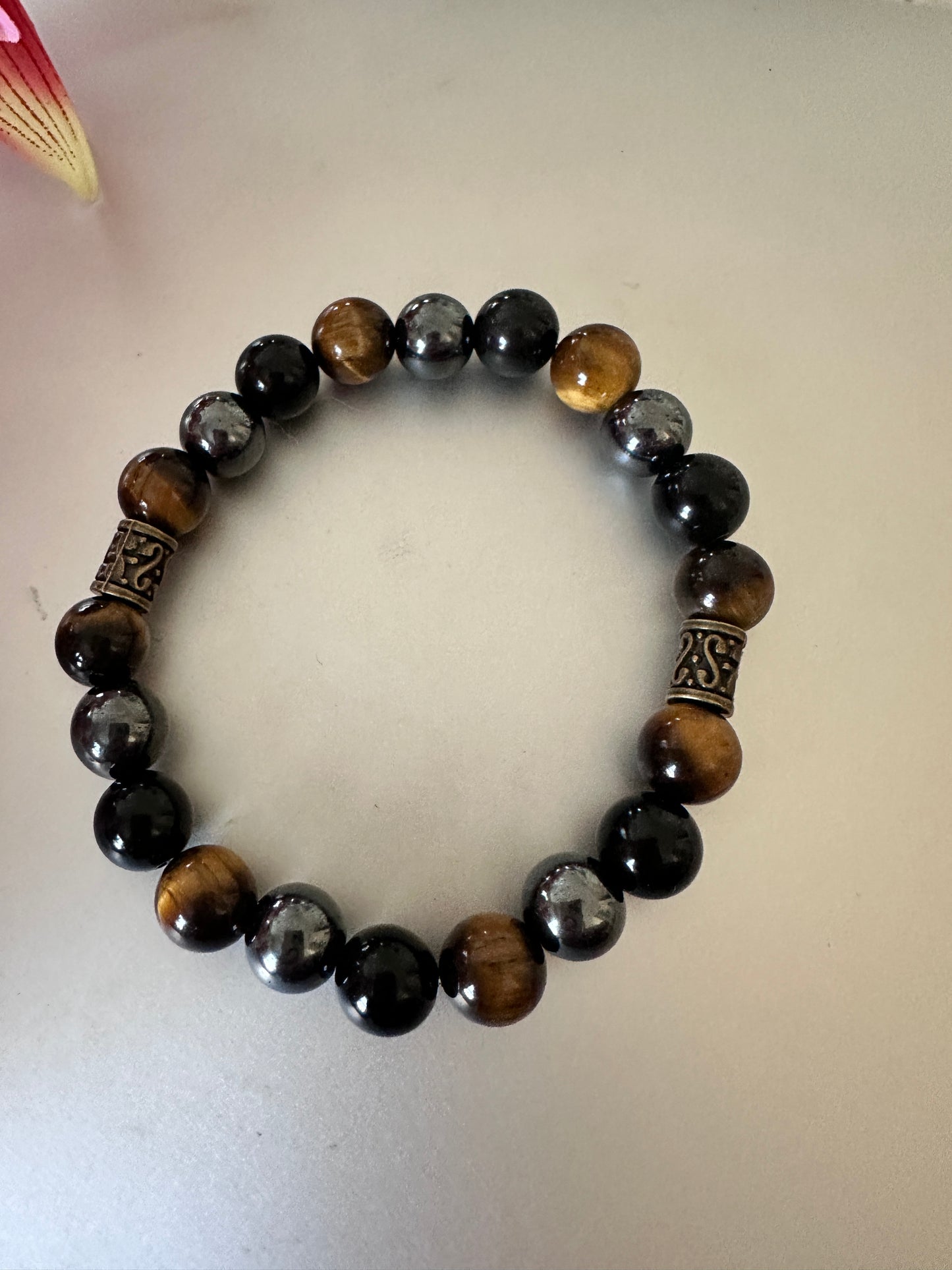 This bracelet has tigers, eye hematite, and black onyx - Creations by Rosa