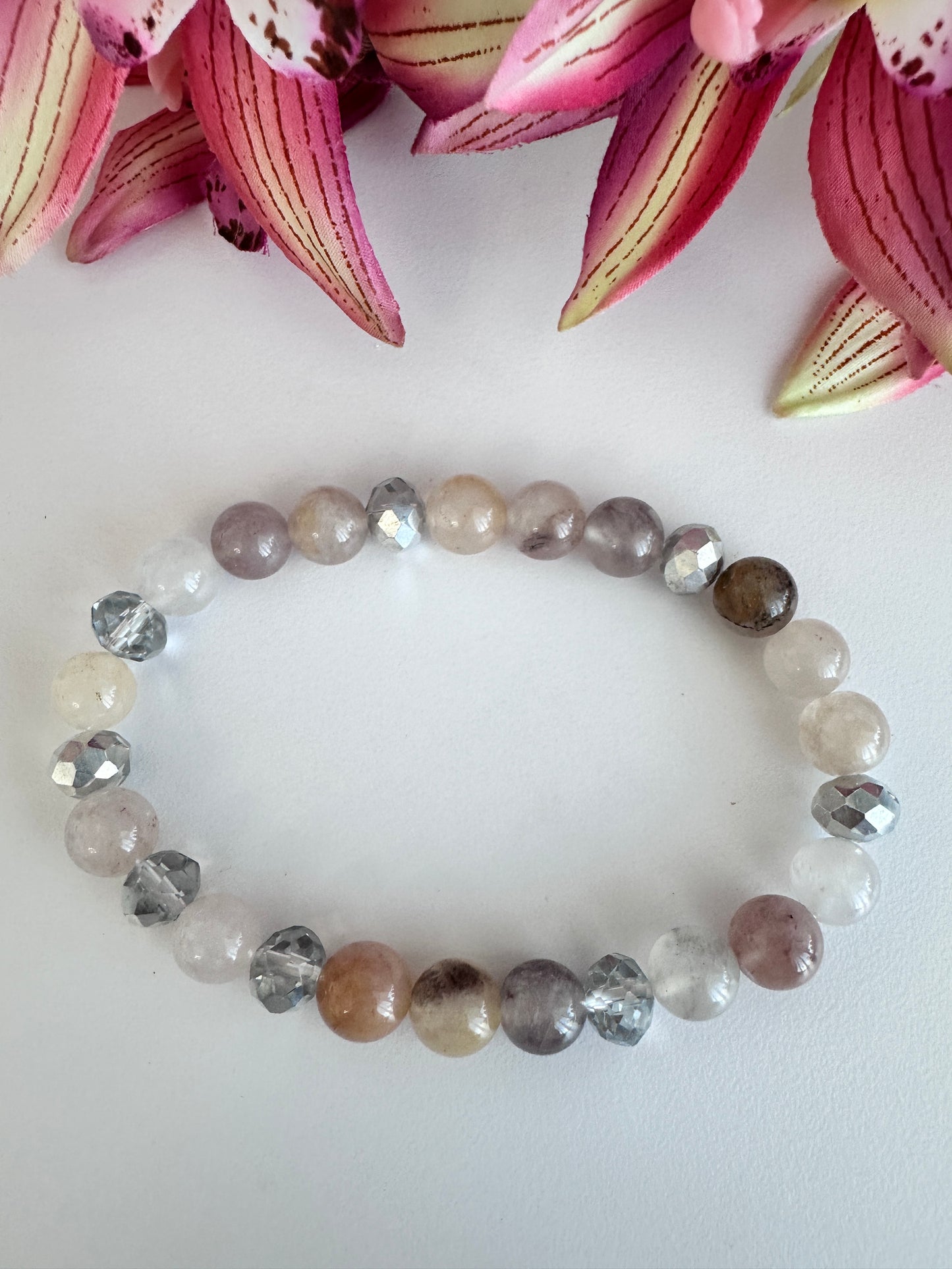 This delicate bracelet is handmade with a sterling silver HOPE pendant, 6 mm white silver rondelle Austrian crystal spacers, and 8 mm Morganite stretch beads. - Creations by Rosa