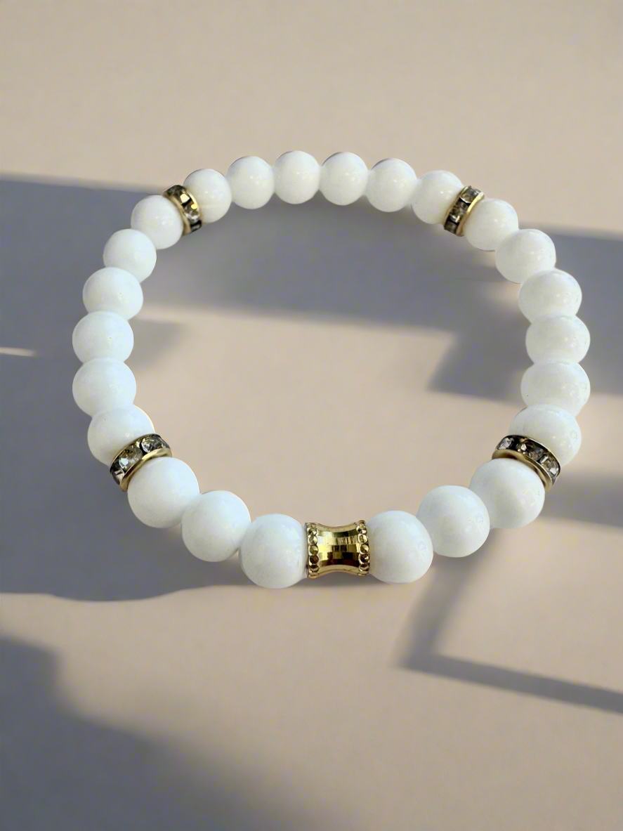 White Agate & Onyx Beads stretch, bracelet, with gold plated spacers.