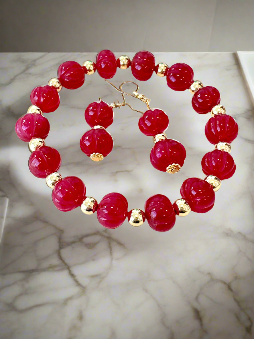 This beautiful Ruby Gemstone Stretch Bead Bracelet and Earrings set is the perfect addition to any jewelry collection. Handmade with care and attention to detail, it features stunning 18 karat Gold Filled 6mm beads and larger 18 karat Gold Filled 10mm bea