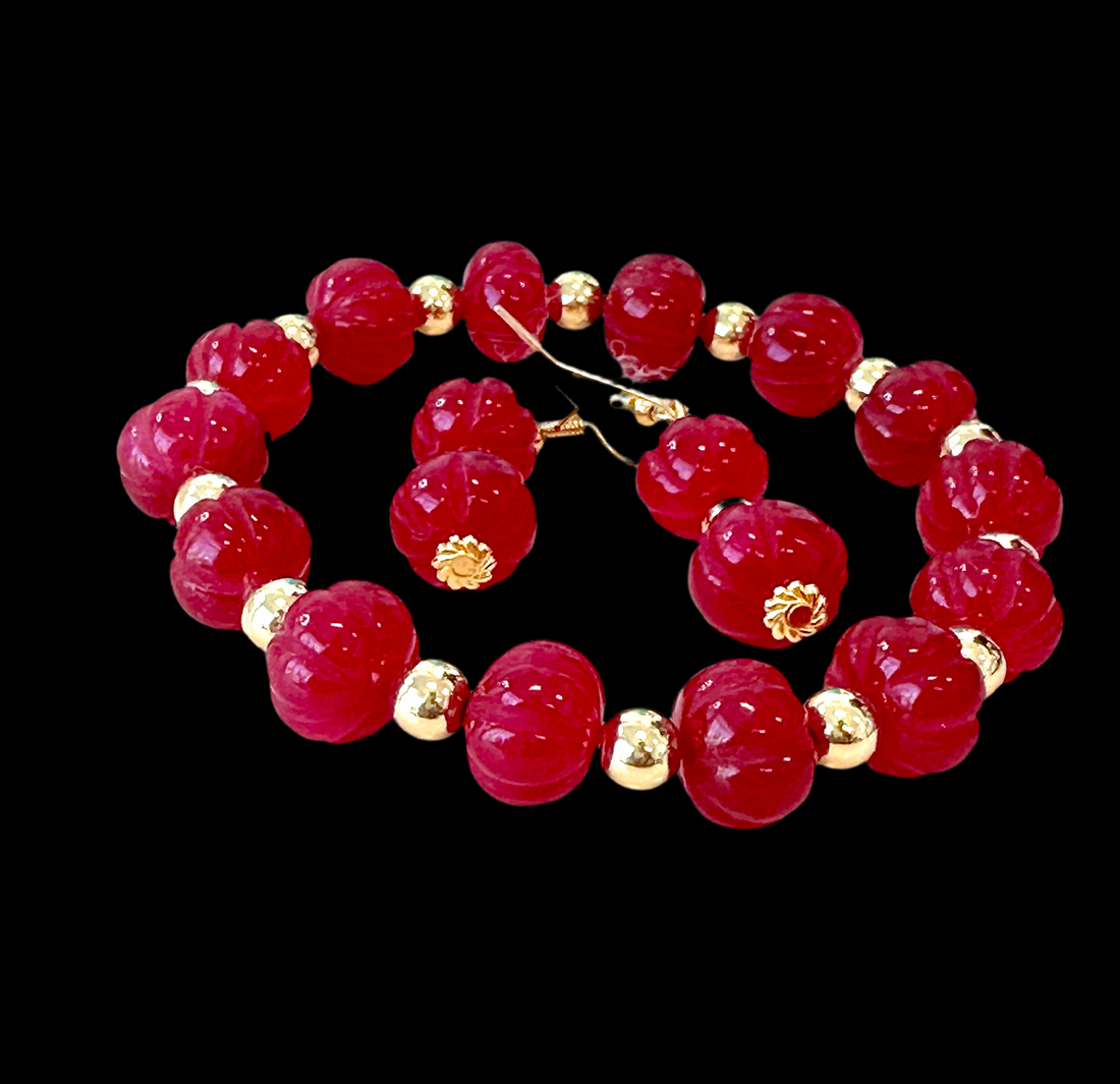 This beautiful Ruby Gemstone Stretch Bead Bracelet and Earrings set is the perfect addition to any jewelry collection. Handmade with care and attention to detail, it features stunning 18 karat Gold Filled 6mm beads and larger 18 karat Gold Filled 10mm bea