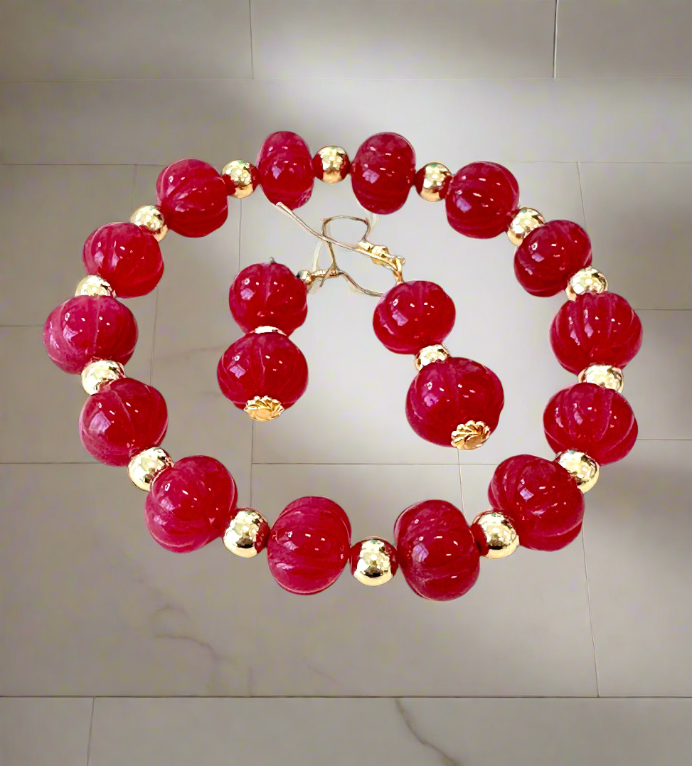 This beautiful Ruby Gemstone Stretch Bead Bracelet and Earrings set is the perfect addition to any jewelry collection. Handmade with care and attention to detail, it features stunning 18 karat Gold Filled 6mm beads and larger 18 karat Gold Filled 10mm bea