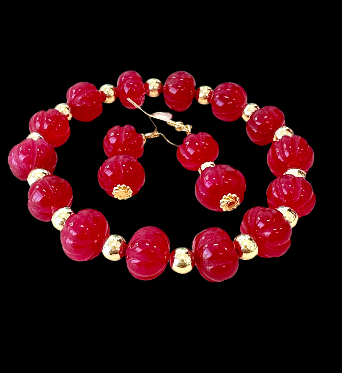 This beautiful Ruby Gemstone Stretch Bead Bracelet and Earrings set is the perfect addition to any jewelry collection. Handmade with care and attention to detail, it features stunning 18 karat Gold Filled 6mm beads and larger 18 karat Gold Filled 10mm bea