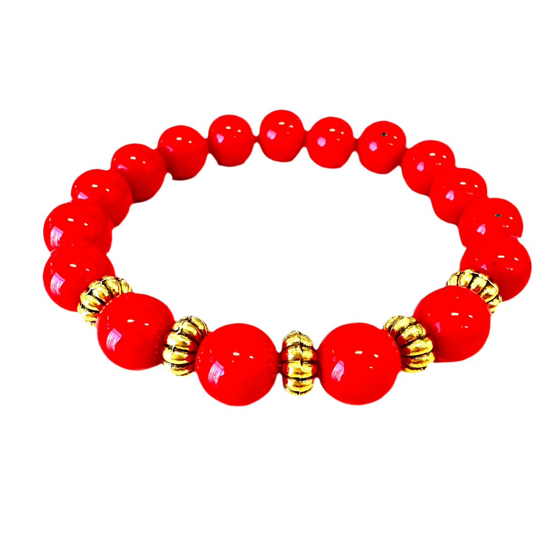 This high-quality Red Coral bracelet, designed with handmade stretches and gold and rondelle spacers, is an ideal present for anyone.