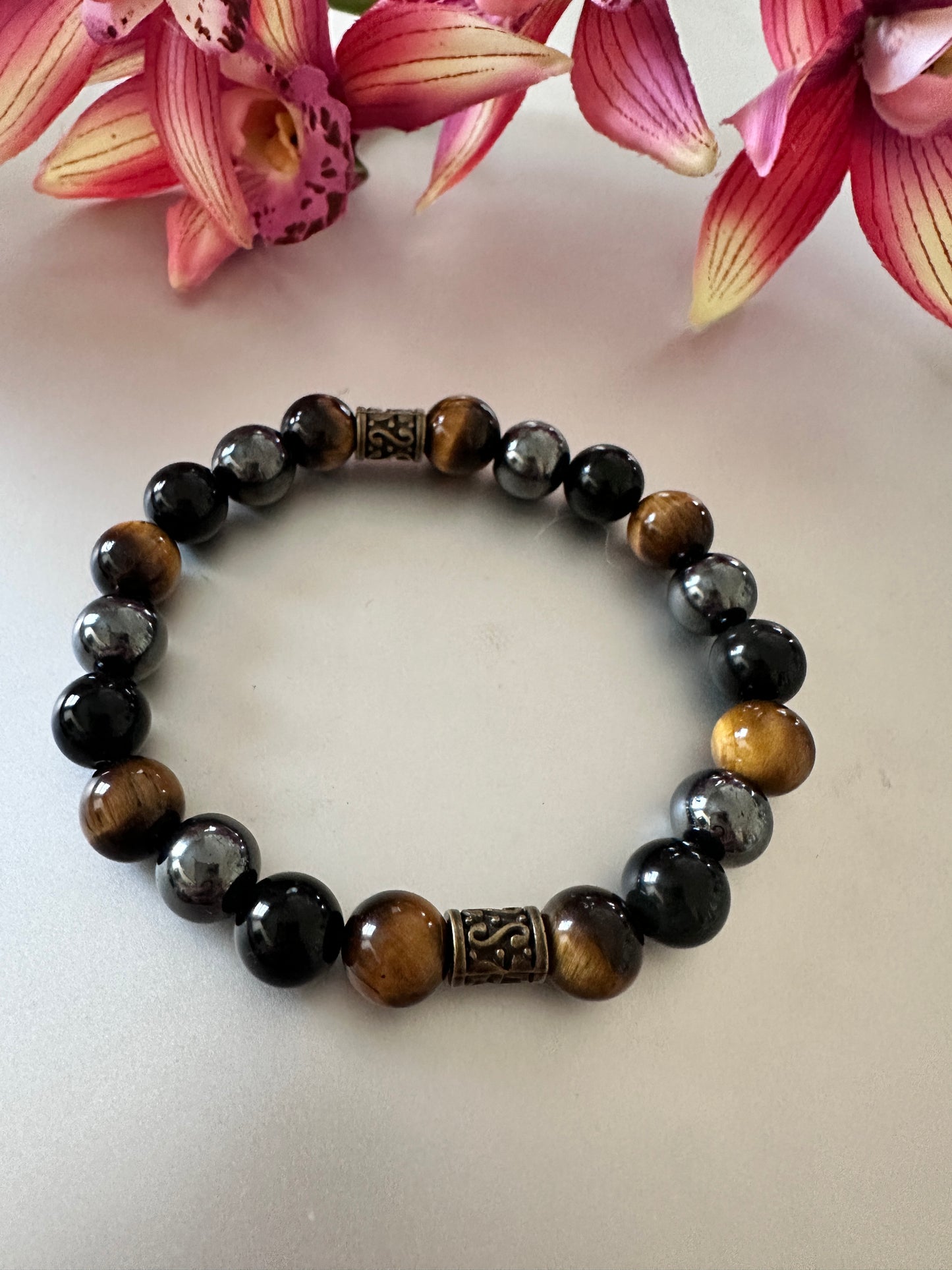 This bracelet has tigers, eye hematite, and black onyx - Creations by Rosa