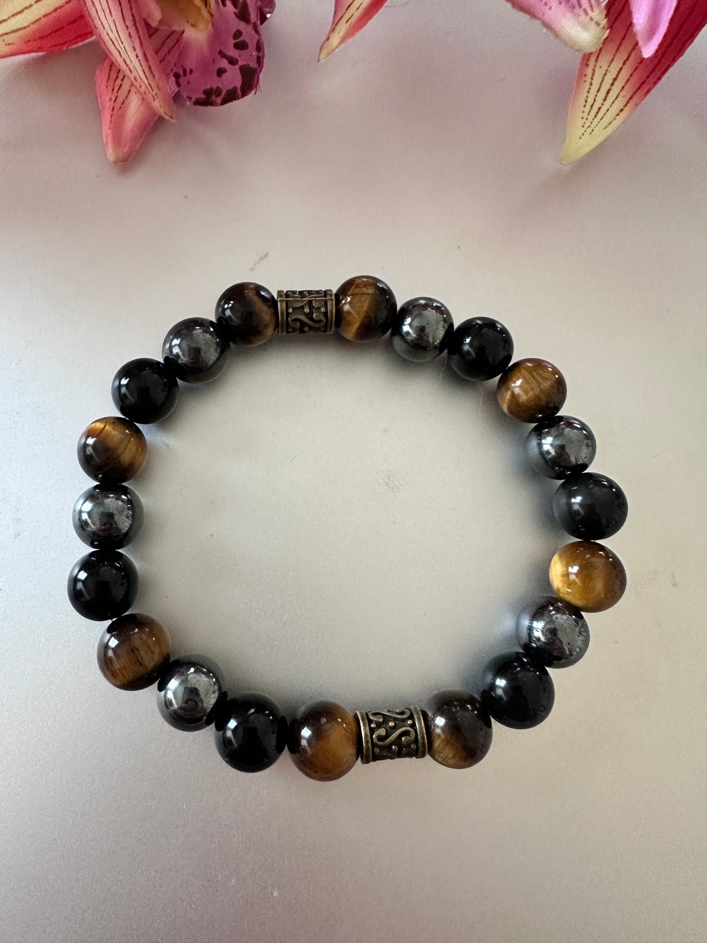 This bracelet has tigers, eye hematite, and black onyx - Creations by Rosa