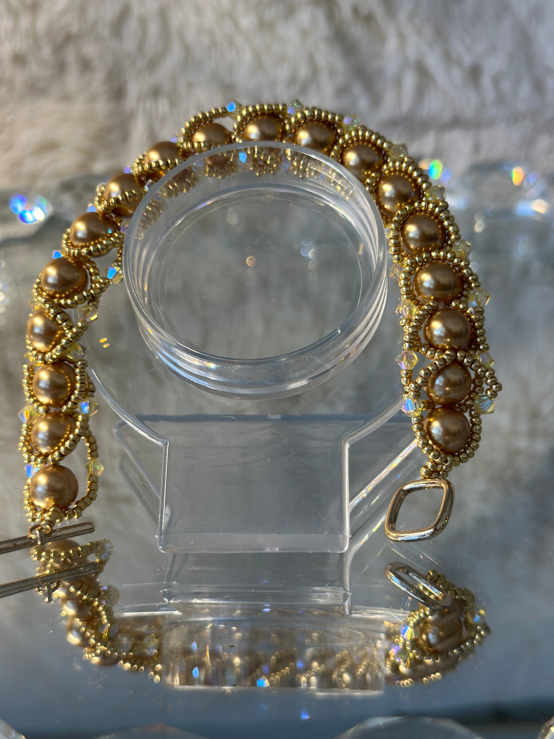 Flat Spiral bracelet with Swarovski pearls an 18 karat plated toggle clasp